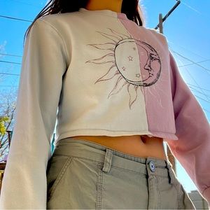 Purple and white long sleeve crop top.